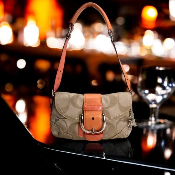 Coach Handbags - COACH Soho Shoulder bag in Signature Canvas and burnt orange leather.